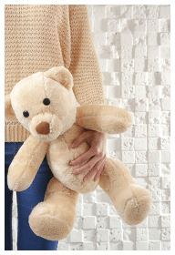 Child holding a stuffed animal